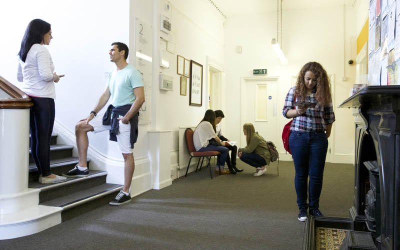 Embassy Hastings students in the common area/foyer at the school.